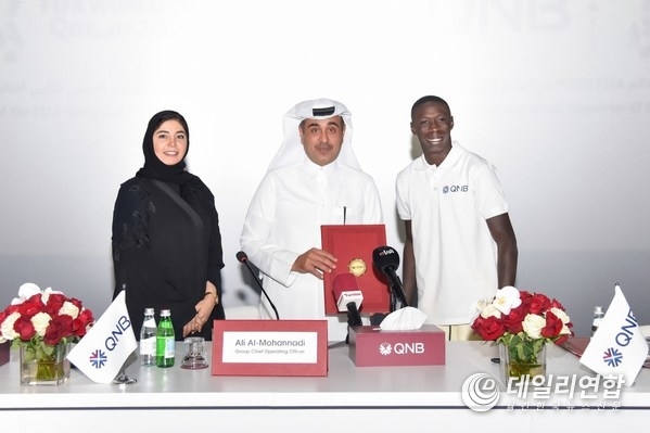 Internet sensation Khabane "Khaby" Lame, the world’s most followed person on TikTok, is pictured at the official signing ceremony with Ali Rashid Al-Mohannadi, QNB Group Executive General Manager & Group Chief Operating Officer, and Heba Ali Al-Tamimi, QNB Group General Manager Group Communications Internet sensation Khabane "Khaby" Lame, the world’s most followed person on TikTok, is pictured at the official signing ceremony with Ali Rashid Al-Mohannadi, QNB Group Executive General Manager & Group Chief Operating Officer, and Heba Ali Al-Tamimi, QNB Group General Manager Group Communications