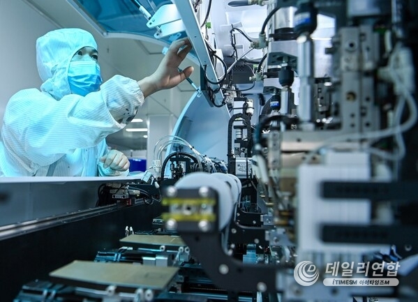 Workers on a LCD display module automated production line in the Peng'an Industrial Park, Nanchong city, Sichuan province.