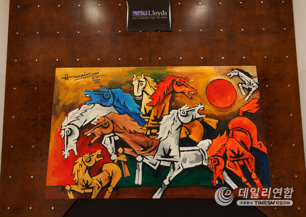 M.F. Husain, Horses (2006), Acrylic on Canvas, 97 x 60 in; a monumental composition of bold, angular forms and striking colors capturing the raw power of horses charging beyond the frame.